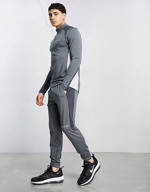 Hombre Pantalones y mallas | Joggers deportivos de corte pitillo con paneles en contraste Active de ASOS Dark Future - FE20278