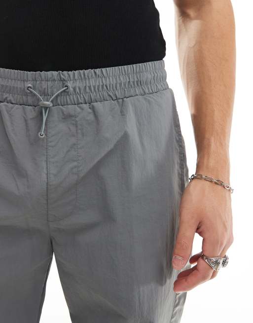 Joggers deportivos gris reflectante de pernera ancha de estilo retro de Karl Kani, 5 de 5