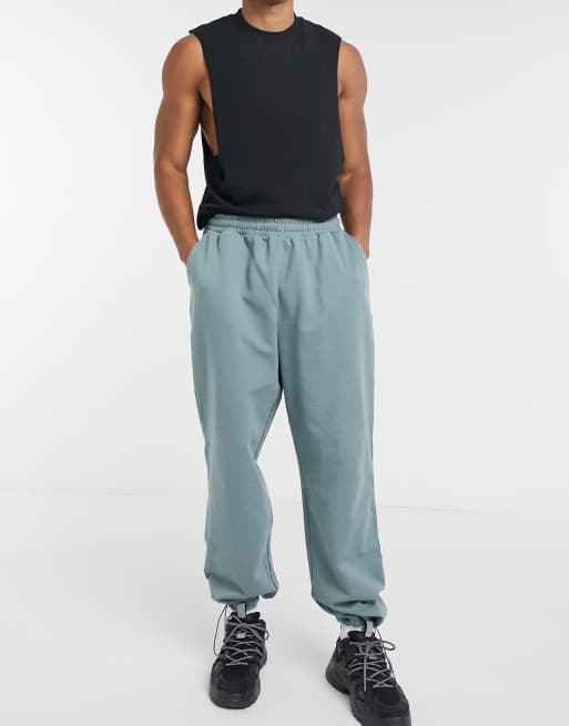 Joggers extragrandes azules grisáceos con alamares en el bajo de algodón orgánico de ASOS DESIGN, 4 de 4