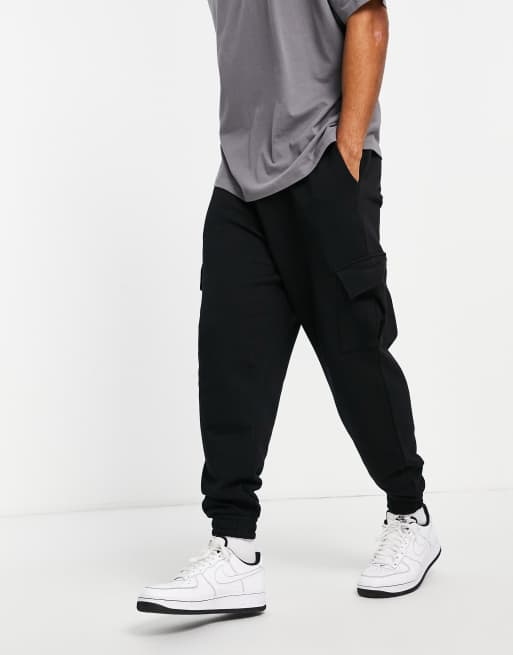 Joggers extragrandes con bolsillos tipo cargo en negro de ASOS DESIGN