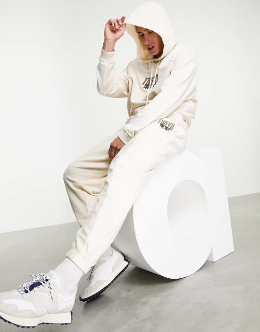 Joggers extragrandes con paneles en contraste y estampado de texto pequeño de ASOS DESIGN (parte de un conjunto)
