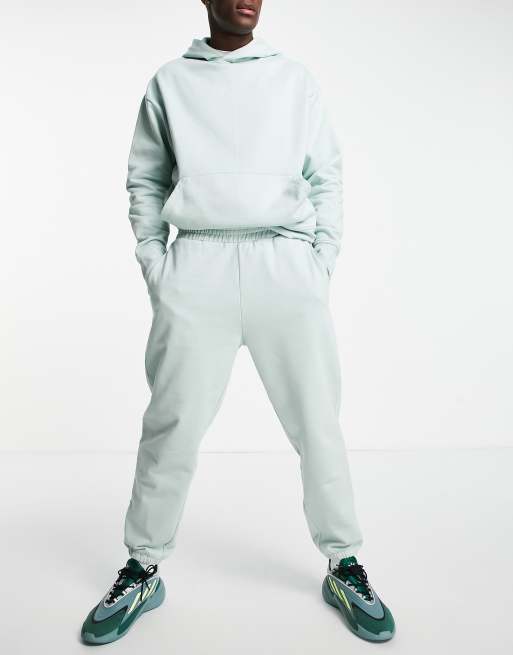 Joggers extragrandes en verde lavado de tejido grueso de ASOS DESIGN (parte de un conjunto)