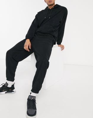 Joggers extragrandes negros de polar de ASOS DESIGN (parte de un conjunto)