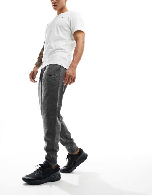 Joggers gris carbón de corte tapered Dri-FIT de Nike Training