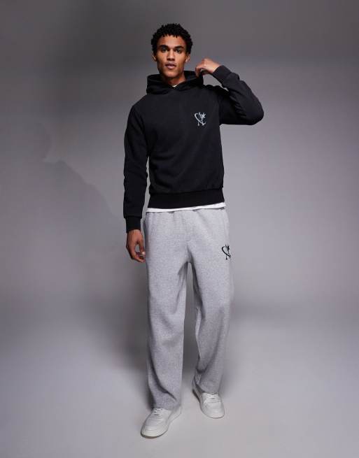 Joggers gris claro de corte suelto con logo de estrella de ADPT, 2 de 5