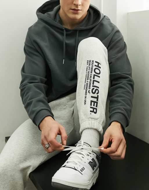 Joggers gris jaspeado de chandal con bajos ajustados y logo en la pernera de Hollister