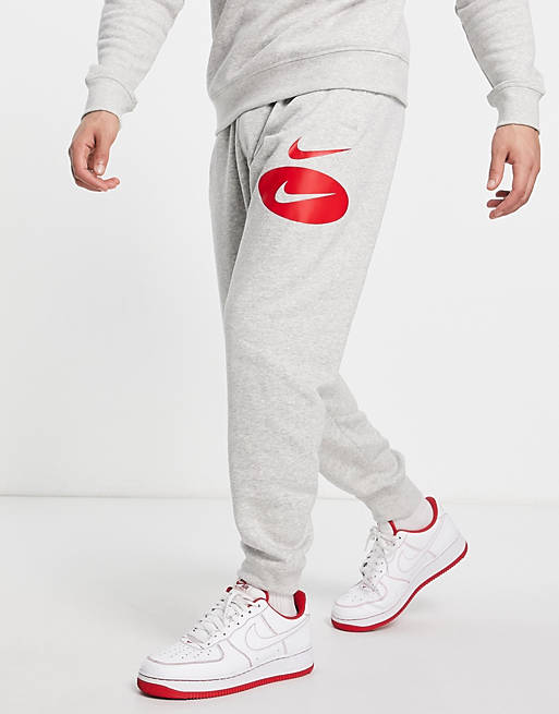 Hombre Joggers de ropa deportiva | Joggers grises con logo de felpa de Nike - PF37166