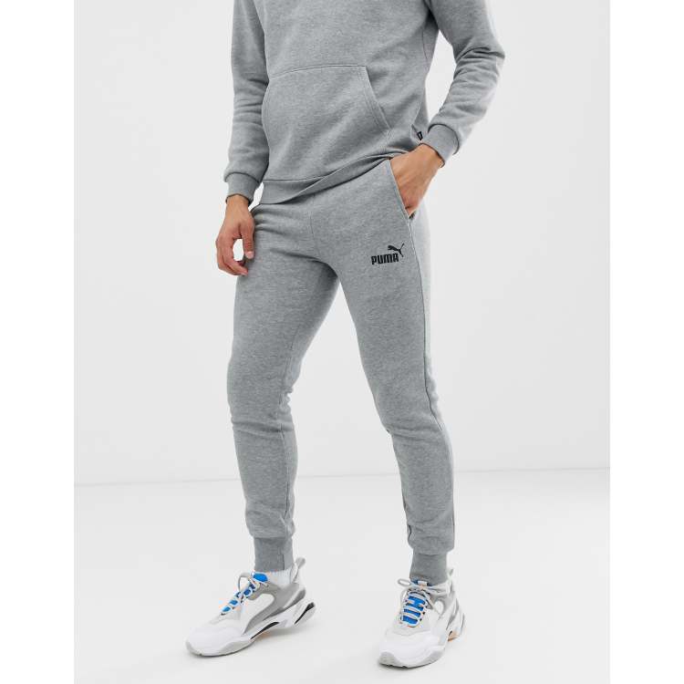 cobre pala capacidad Joggers grises de corte slim con logo pequeño Essentials de Puma | ASOS