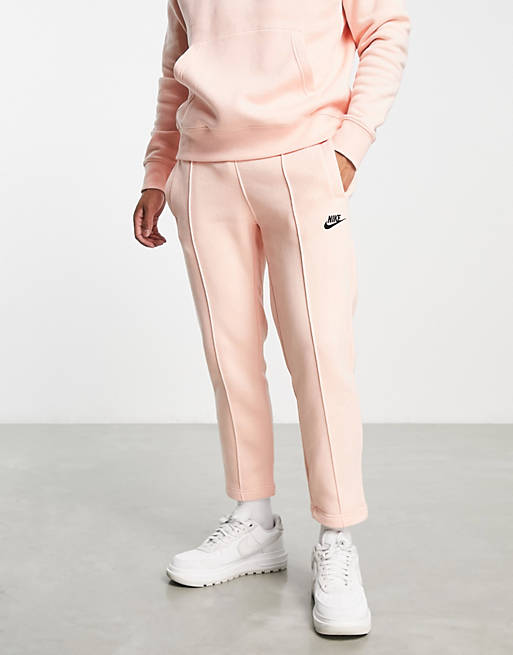 Hombre Pantalones y mallas | Joggers naranja pálido Club de Nike - RM74035