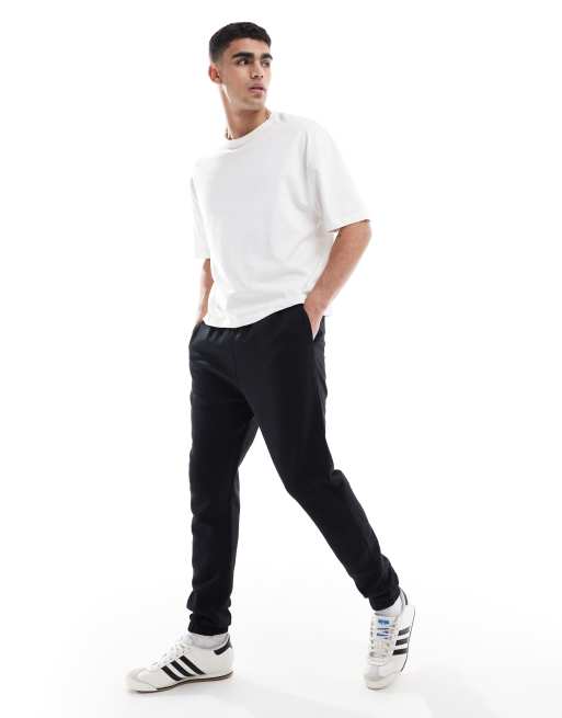 Joggers negros básicos de corte pitillo de ASOS DESIGN