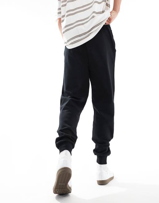 Joggers negros básicos de corte tapered de ASOS DESIGN, 3 de 5