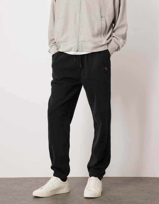 Joggers negros con bajos ajustados y logo de felpa Icon de Abercrombie & Fitch