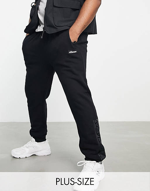 Hombre Pantalones y mallas | Joggers negros con banda con logo de ellesse Plus - MO07689