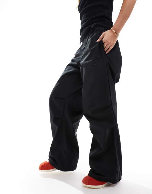 Joggers negros con cremallera delantera de felpa Swoosh de Nike, 5 de 5