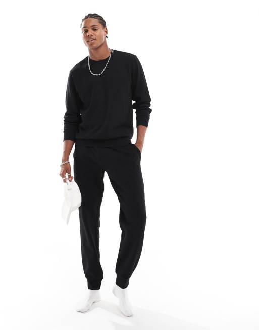 Joggers negros con cuello redondo de tejido texturizado de Emporio Armani Bodywear (parte de un conjunto) 