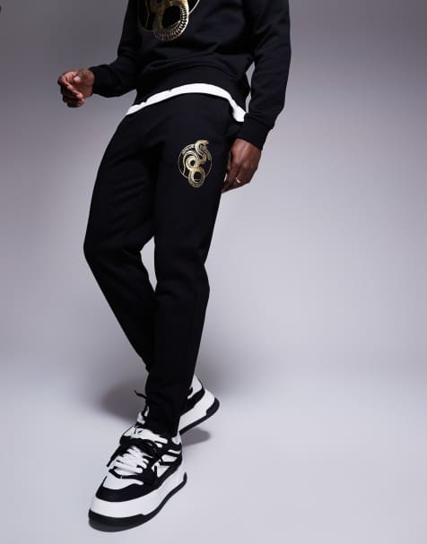 Joggers negros con detalle de serpiente de la colección cápsula Lunar de Armani Exchange - view 1