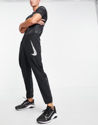 Joggers negros con diseño reflectante de punto Run Division Challenger Flash de Nike Running