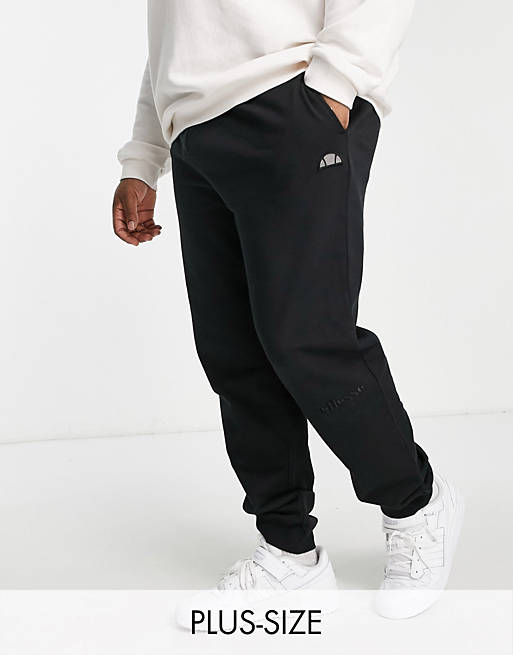 Hombre Pantalones y mallas | Joggers negros con logo de ellesse Plus - UP98442