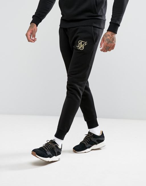 Chándal negro con detalle del logo dorado de SikSilk ASOS