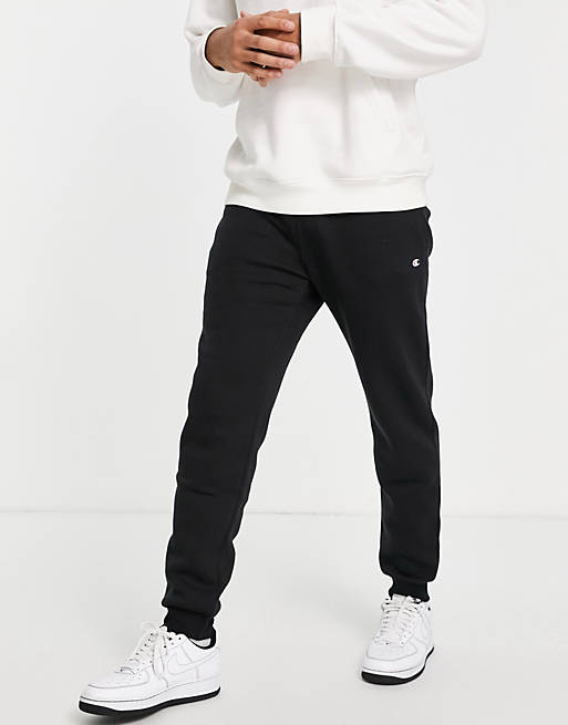 Hombre Pantalones y mallas | Joggers negros con logo pequeño de Champion - UH33129