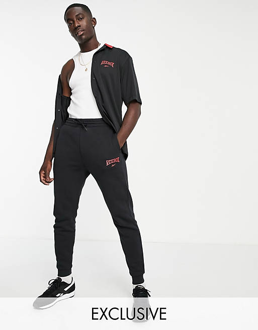 Hombre Pantalones y mallas | Joggers negros con logo vintage exclusivos en ASOS de Reebok - IY17638