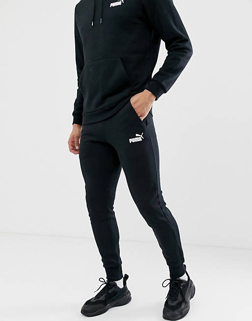 Hombre Joggers de ropa deportiva | Joggers negros de corte slim con logo pequeño Essentials de Puma - TB75734