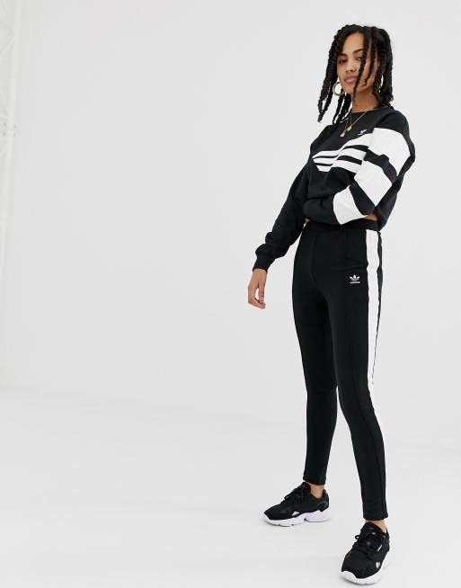 Joggers negros de corte slim con raya en el lateral de adidas Originals
