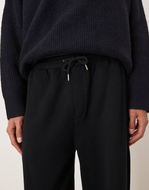Joggers negros de corte tapered con bajos ajustados de ASOS DESIGN, 5 de 5
