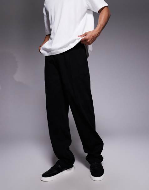 Joggers negros de corte tapered con jaretas y bajos sobrehilados de tejido grueso de ASOS DESIGN - view 1