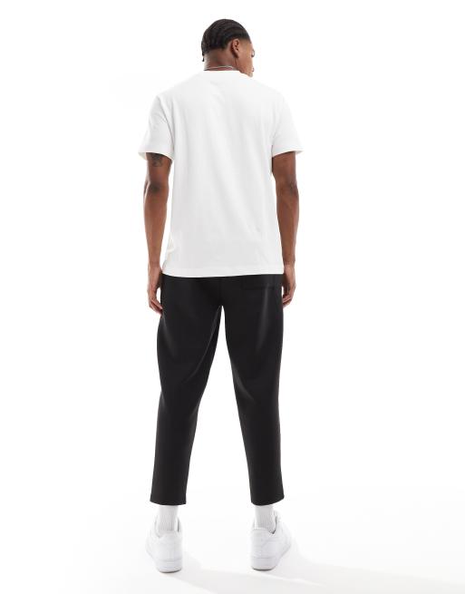 Joggers negros de corte tapered de tejido grueso efecto neopreno de ASOS DESIGN, 4 de 5