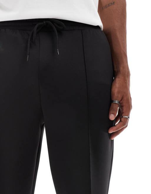 Joggers negros de corte tapered de tejido grueso efecto neopreno de ASOS DESIGN, 5 de 5