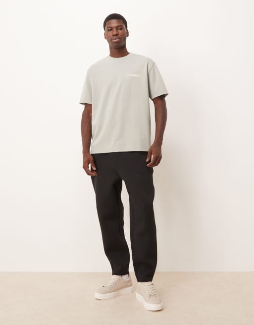 Joggers negros de corte tapered de tejido grueso efecto neopreno de ASOS DESIGN, 2 de 5