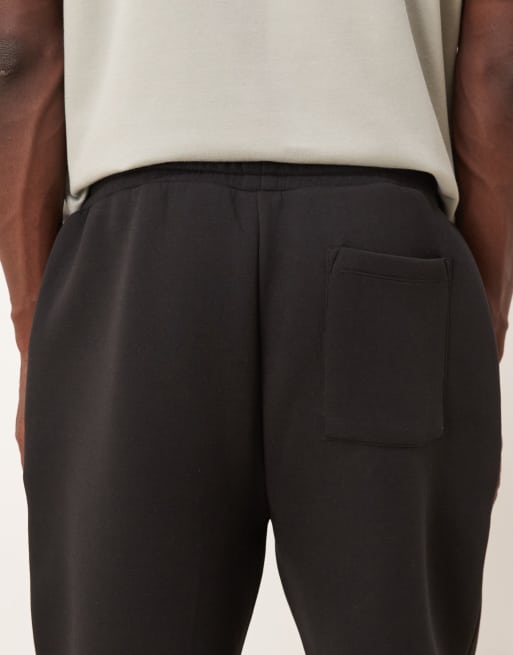 Joggers negros de corte tapered de tejido grueso efecto neopreno de ASOS DESIGN, 5 de 5