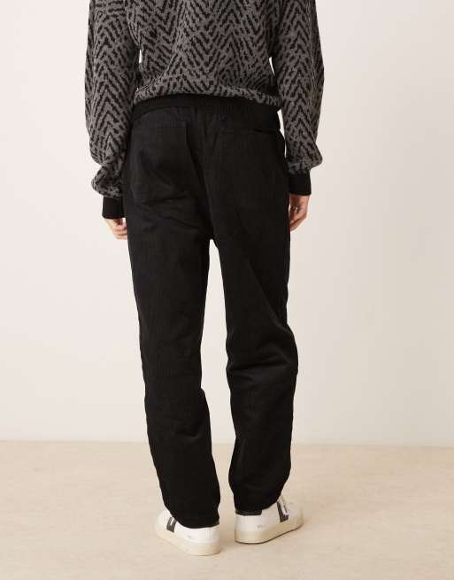Joggers negros de corte tapered sin cierres de pana de ASOS DESIGN  , 2 de 5
