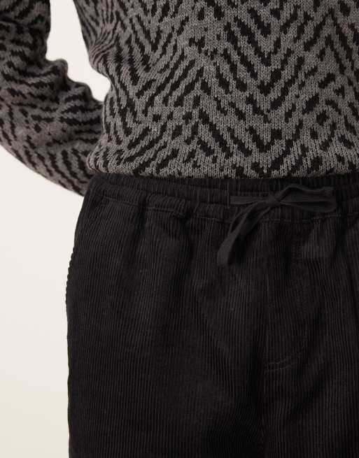 Joggers negros de corte tapered sin cierres de pana de ASOS DESIGN  , 4 de 5