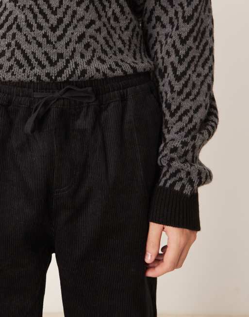 Joggers negros de corte tapered sin cierres de pana de ASOS DESIGN  , 5 de 5
