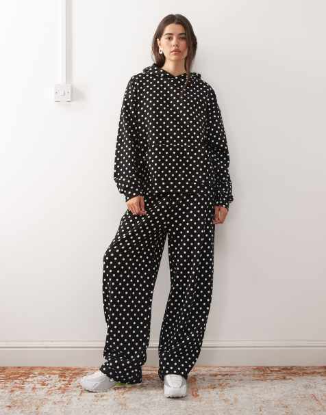 Joggers negros de pernera ancha con estampado de lunares blancos de COLLUSION - view 1