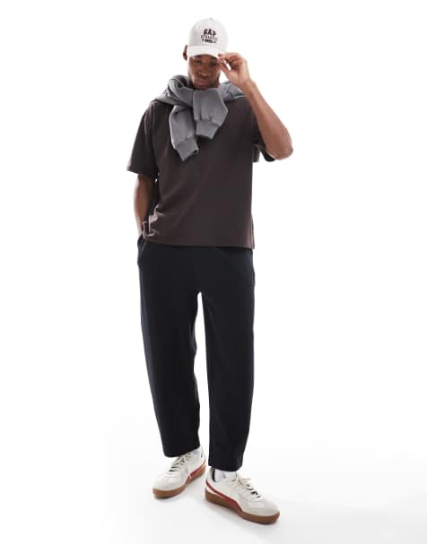 Joggers negros extragrandes de corte tapered de ASOS DESIGN - view 1