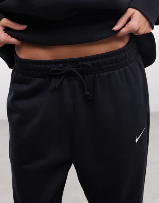 Joggers negros extragrandes de talle alto con bajos ajustados Phoenix Fleece de Nike, 4 de 5