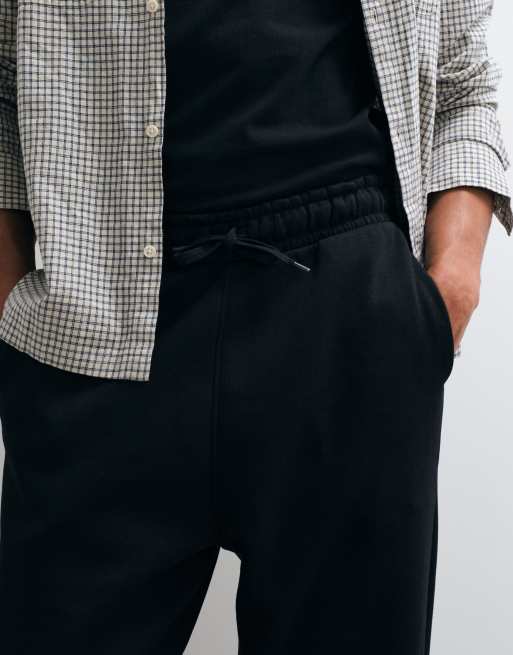 Joggers negros holgados básicos Essentials de ASOS DESIGN, 4 de 5