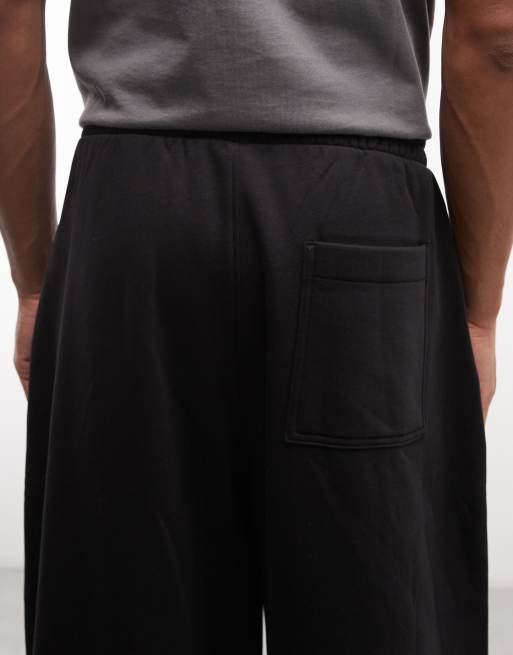 Joggers negros plisados de pernera barrel ancha de Weekday, 5 de 5