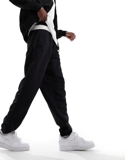 Joggers negros y blancos sueltos de nailon de The North Face, 5 de 5