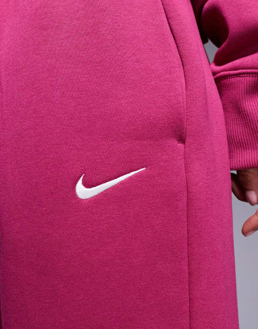 Joggers rosas extragrandes de talle alto con bajos ajustados Phoenix Fleece de Nike , 4 de 5