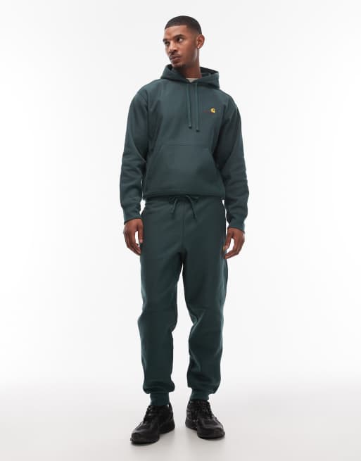 Joggers verde oscuro con detalle de texto American de Carhartt WIP, 2 de 5