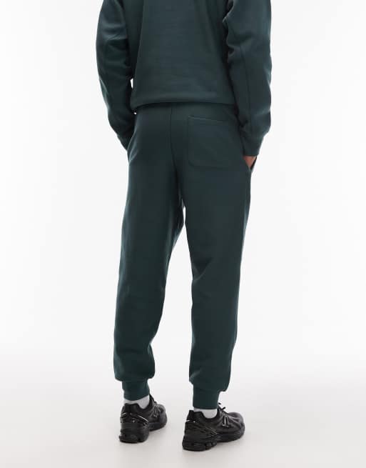 Joggers verde oscuro con detalle de texto American de Carhartt WIP, 3 de 5
