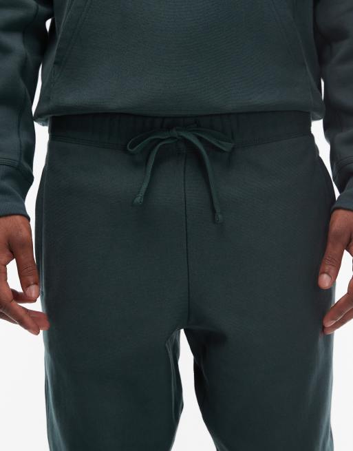 Joggers verde oscuro con detalle de texto American de Carhartt WIP, 4 de 5
