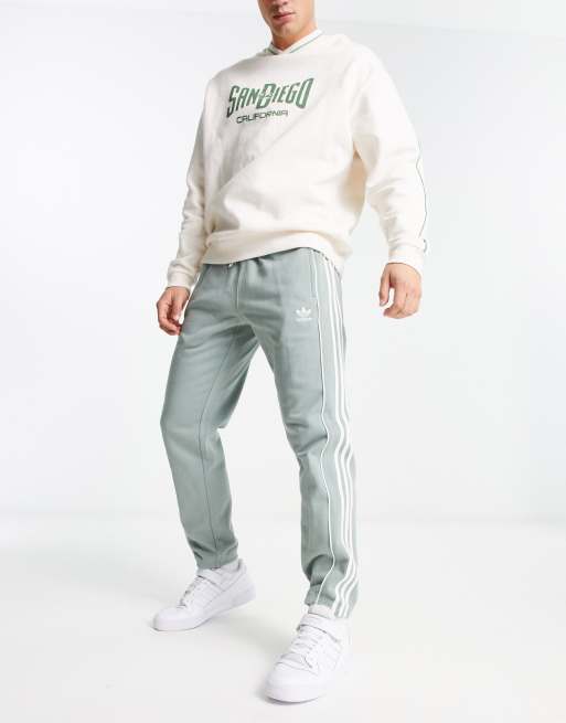 Joggers verdes con logo y 3 rayas Rekive de adidas Originals