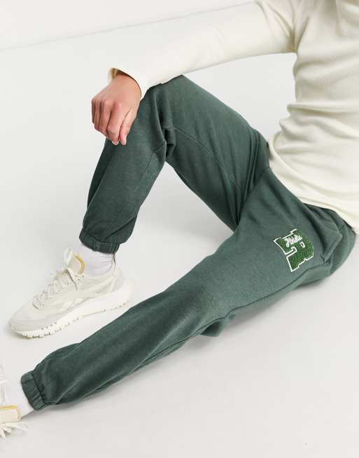Joggers verdes Thomas de Russell Athletic (parte de un conjunto)