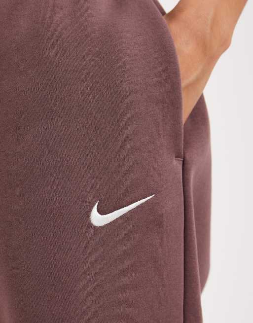 Joggers violeta oscuro extragrandes de talle alto con bajos ajustados Phoenix Fleece de Nike, 4 de 5