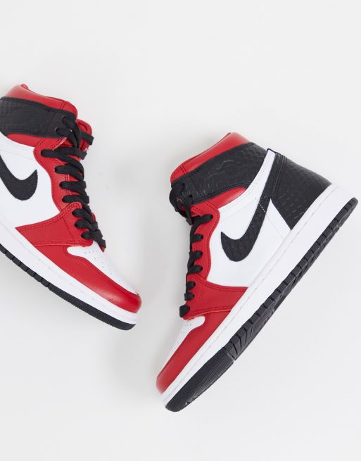 Jordan Air 1 High OG Sneakers rosse e nere pitonate